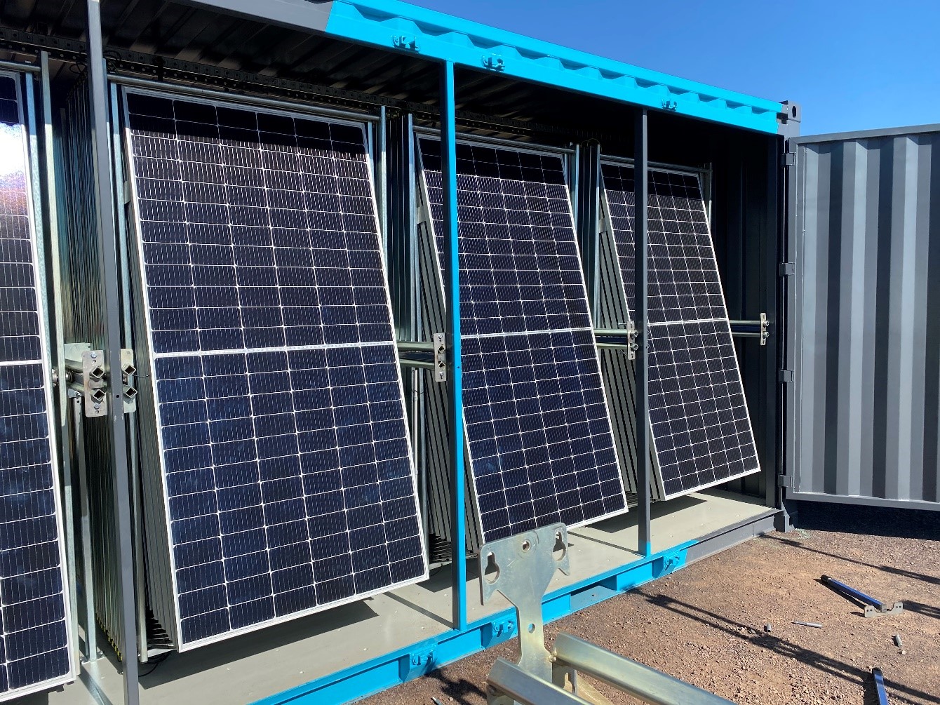 Solarator® grid-connect partially opened showing close up of solar panel arrays