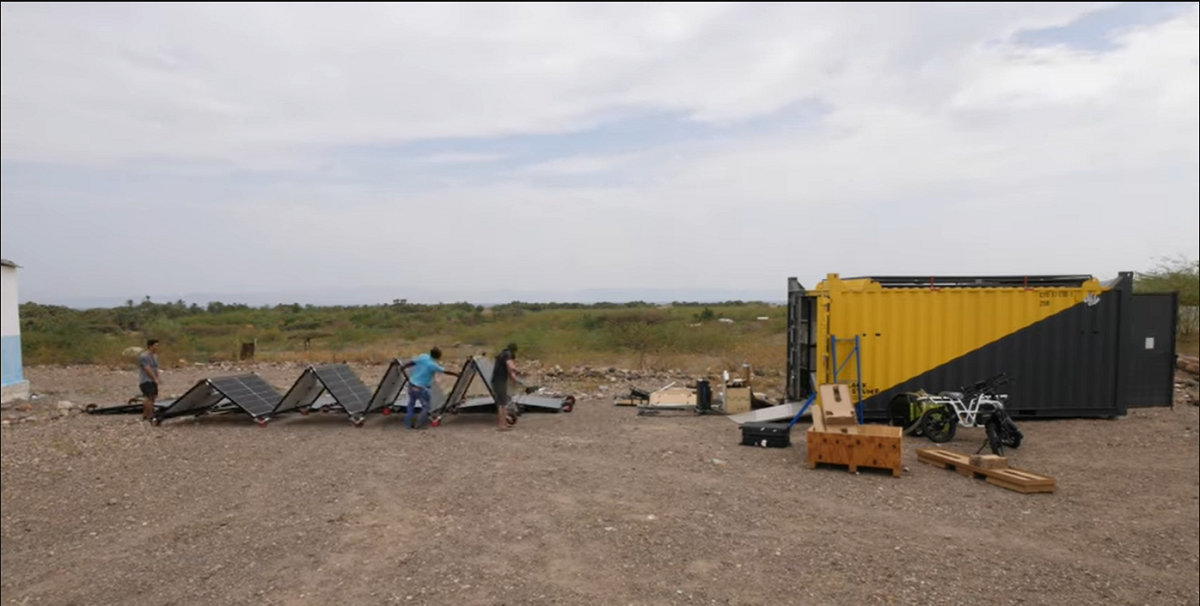 People deploying a Custom Solarator® solar panel arrays