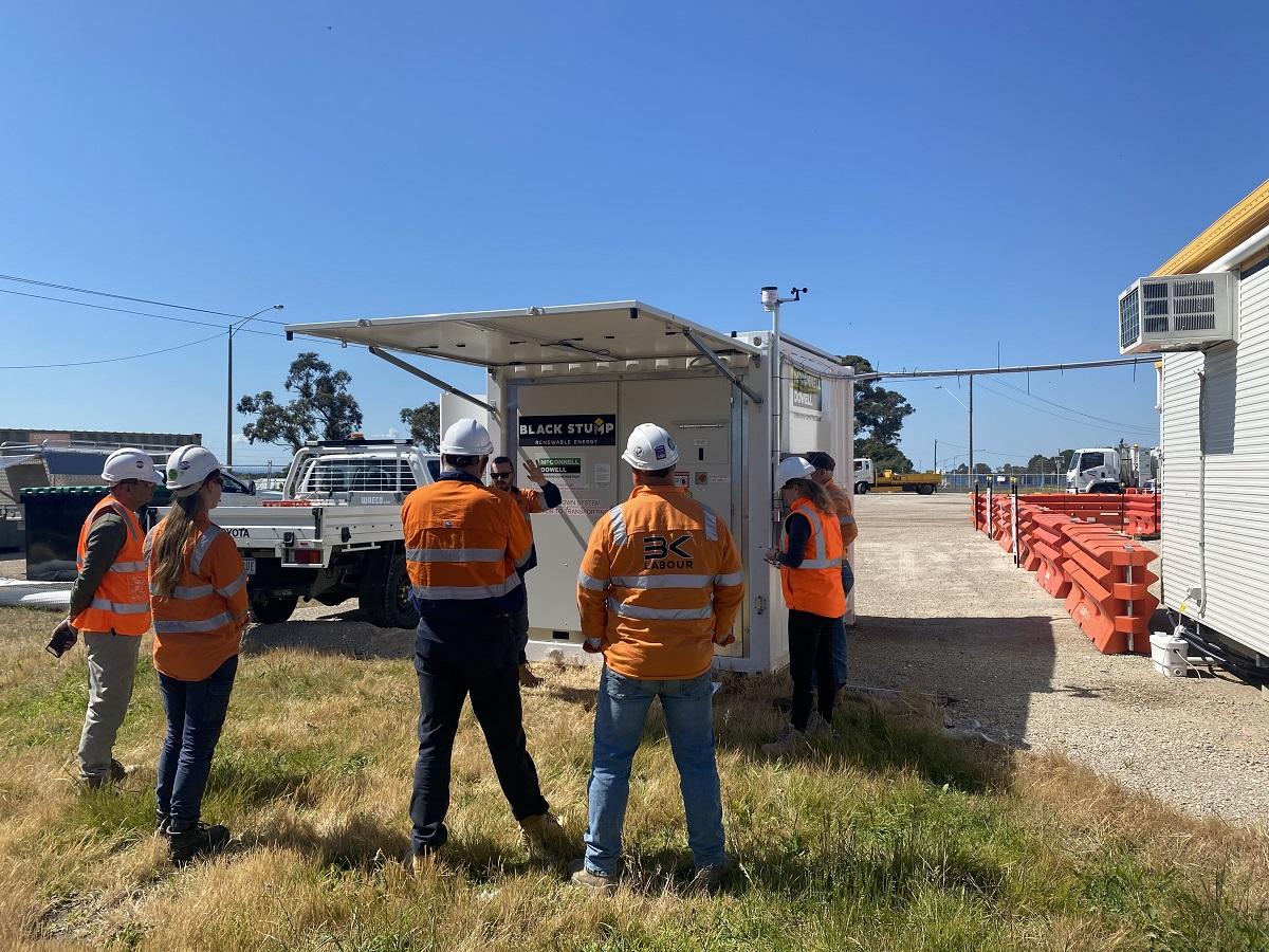 Image of people gathered around a Solarator